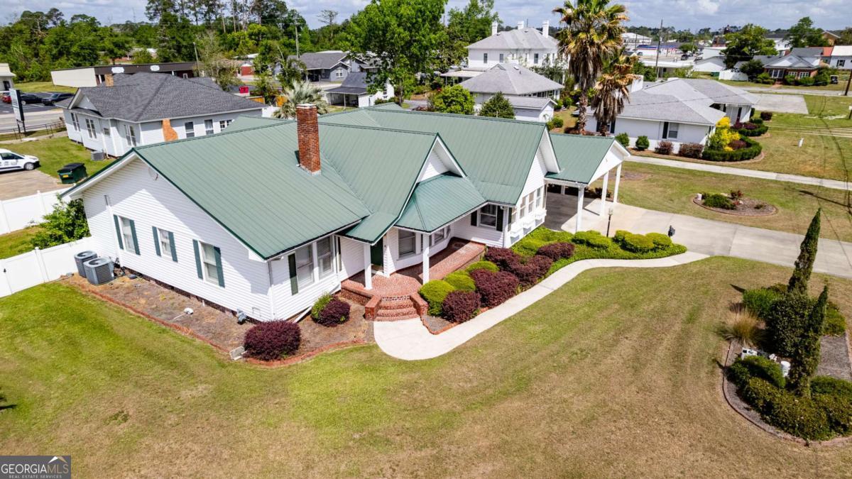 316 Fair Street Baxley, GA 31513 - Photo 62 of 64 an aerial view of a house with swimming pool patio and outdoor seating