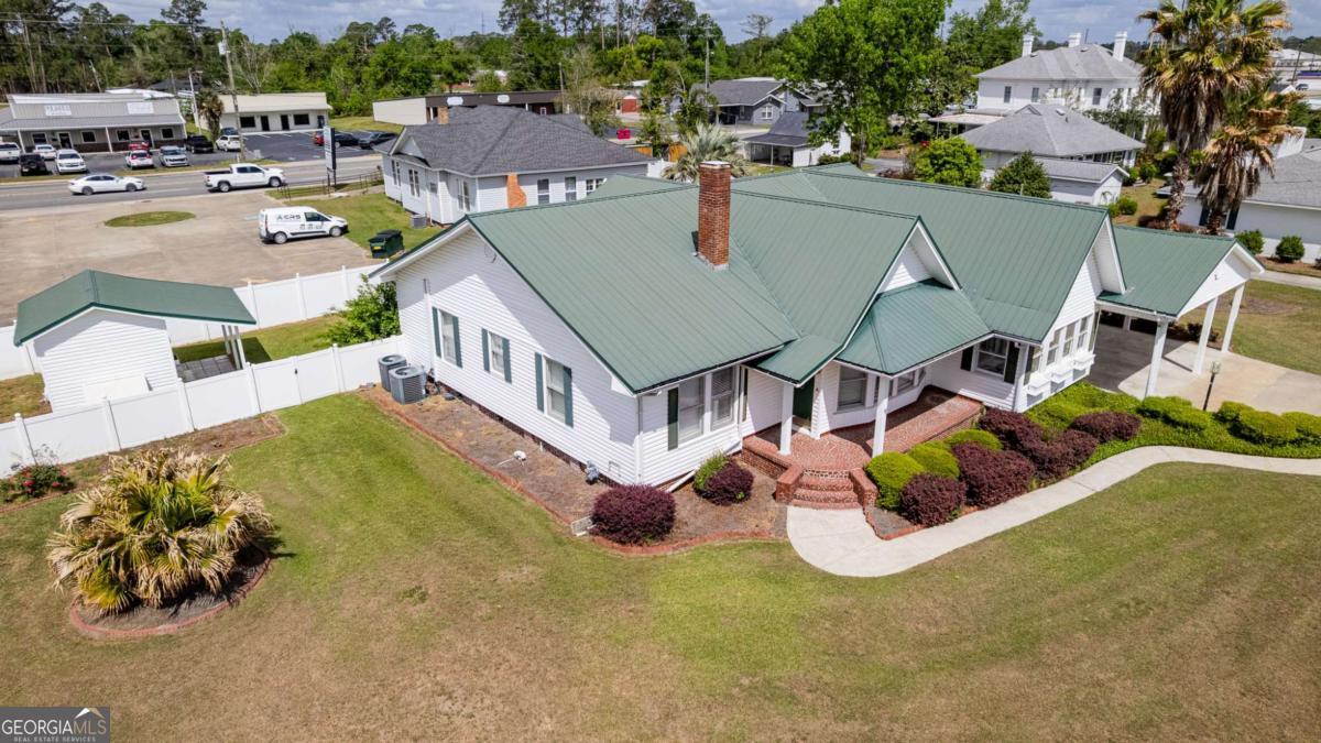 316 Fair Street Baxley, GA 31513 - Photo 63 of 64 an aerial view of a house with swimming pool and outdoor seating