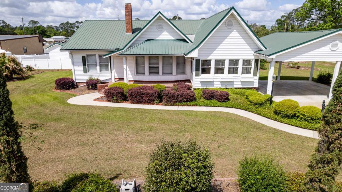 316 Fair Street Baxley, GA 31513 - Photo 64 of 64 a front view of a house with garden
