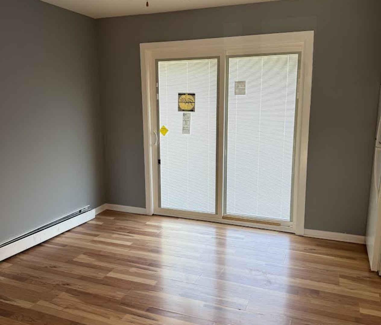 7719 South Roberts Road Bridgeview, IL 60455 - Photo 5 of 10 a view of an empty room with wooden floor and a window