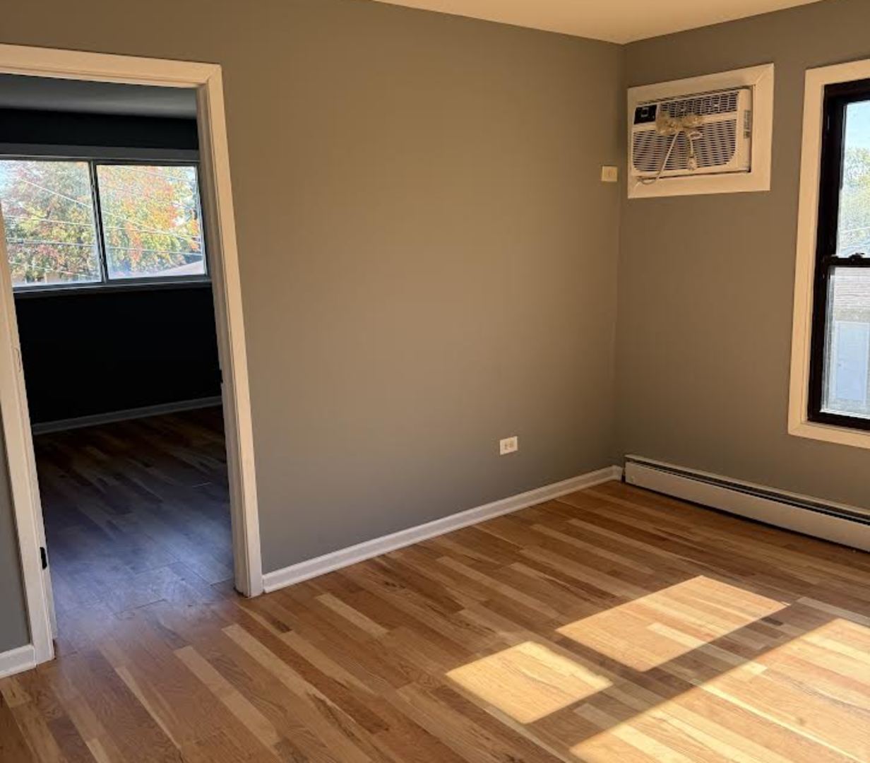 7719 South Roberts Road Bridgeview, IL 60455 - Photo 7 of 10 a view of an empty room and window