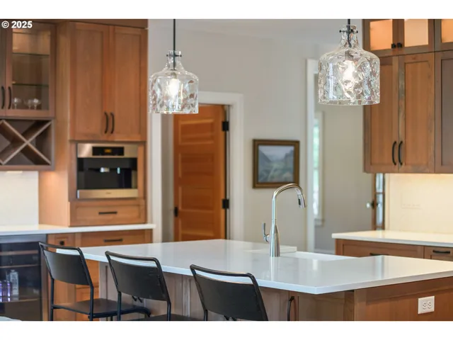 a bathroom with granite countertop a sink and a mirror