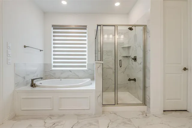 a bathroom with a sink a mirror and a bathtub