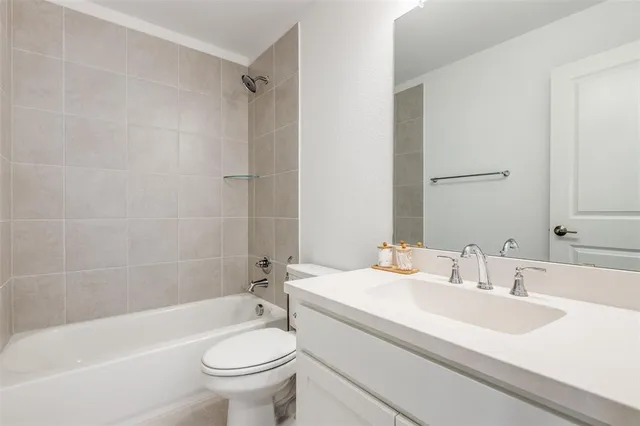 a bathroom with a sink a toilet and a bathtub