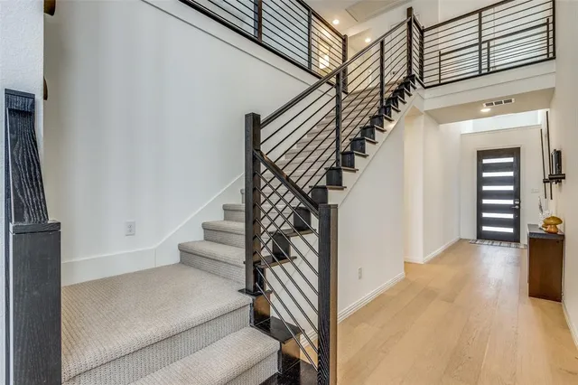 a kitchen with stainless steel appliances kitchen island granite countertop a sink a stove a refrigerator and cabinets