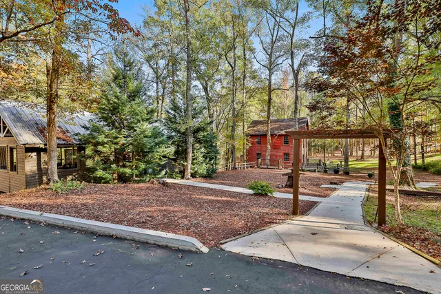 a view of a street with houses on the roadside