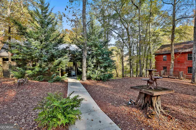 a view of a backyard with sitting area