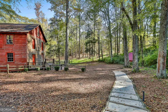 a view of a park with large trees