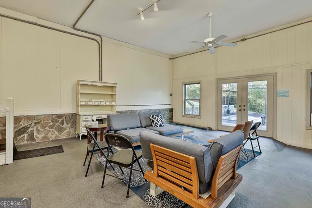 a room with a bed and wooden floor