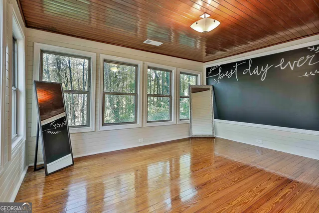 a view of livingroom with hardwood floor and a ceiling fan