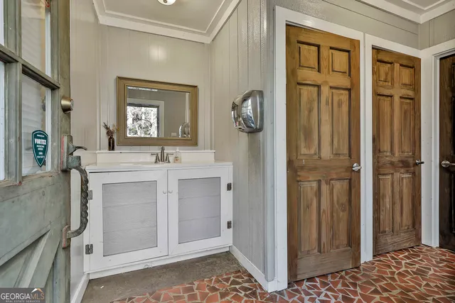 a bathroom with a sink and a mirror