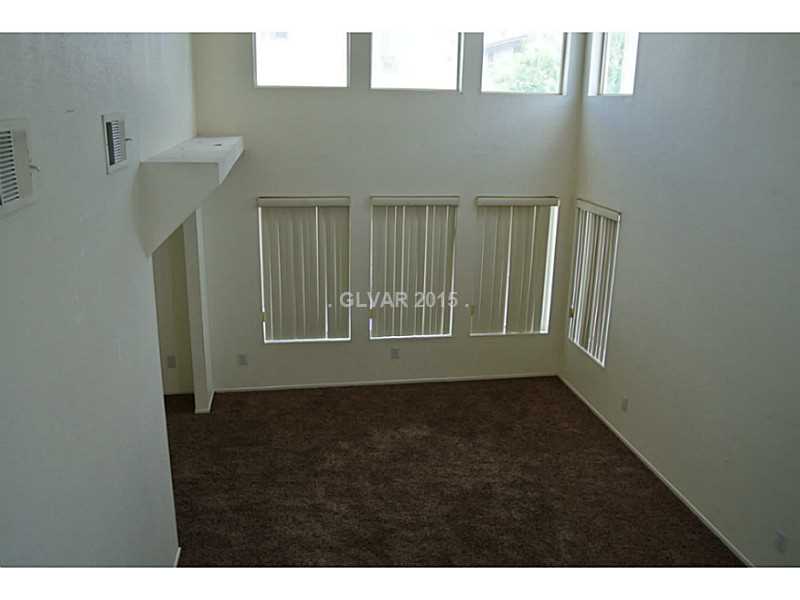 4216 Riker Avenue Las Vegas, NV 89115 - Photo 9 of 12 Living Room. View from staircase landing