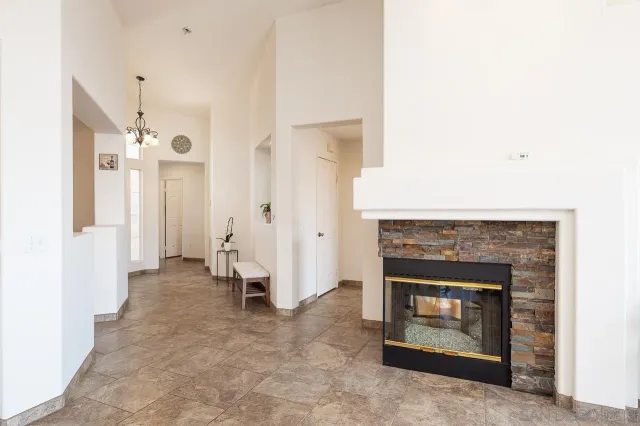 a view of an empty room and fire place