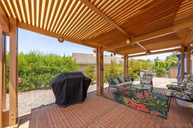 a view of a patio with wooden floor