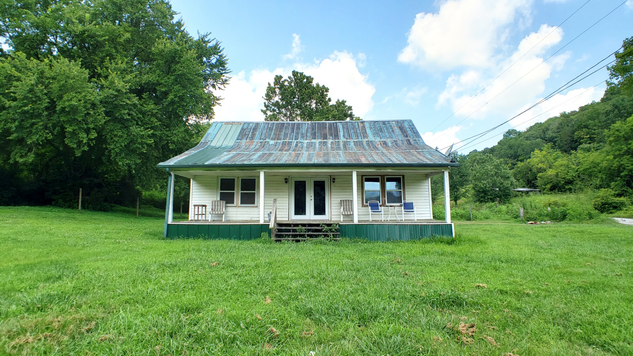 8100 Eaton Hollow Road Christiana, TN 37037 - Photo 19 of 27 a front view of house with garden and trees