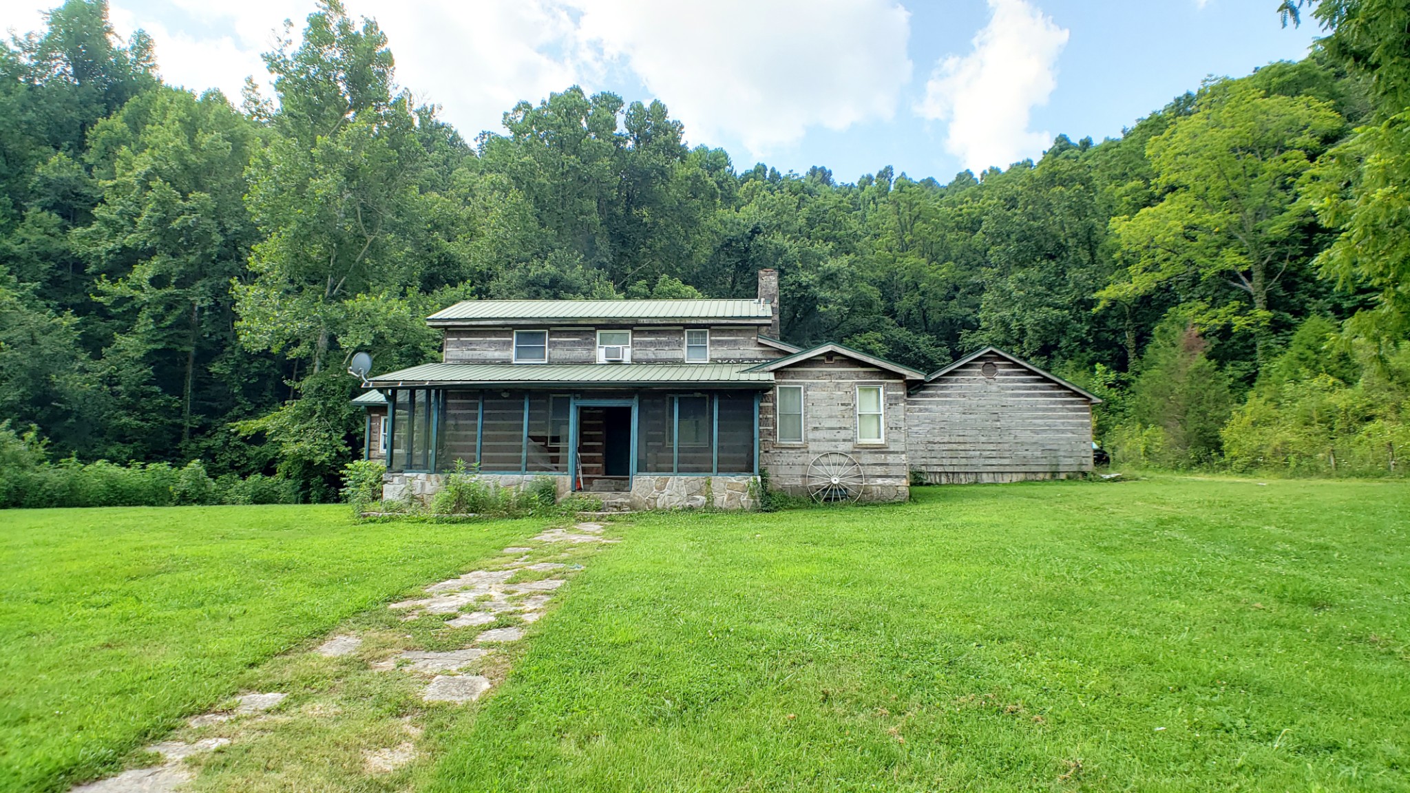 8100 Eaton Hollow Road Christiana, TN 37037 - Photo 2 of 27 a view of a house with a garden