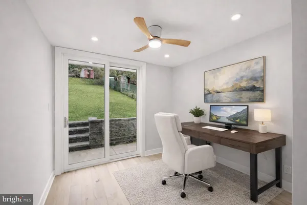 a work room with furniture and a window