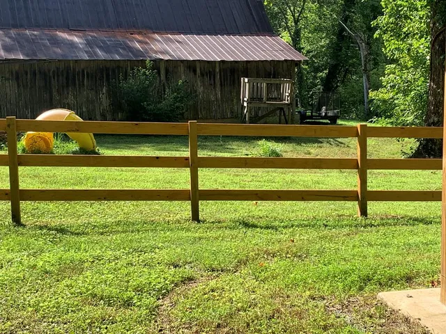 a view of backyard with deck and garden