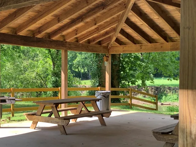 a view of a patio with a table chairs and a backyard