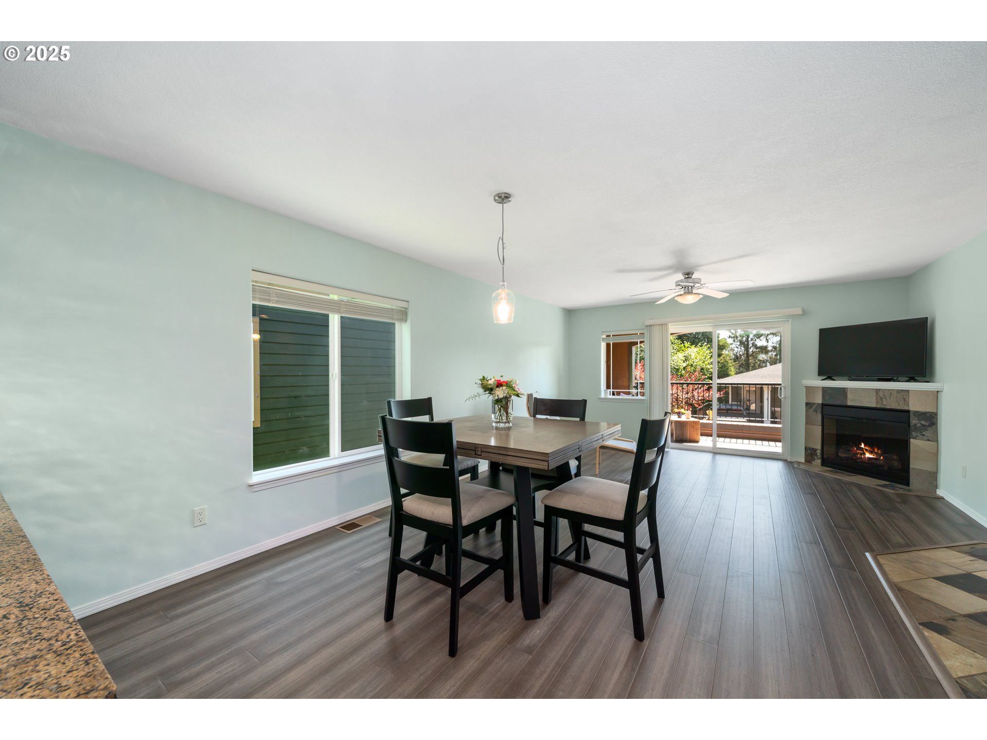 13150 D Street, Unit 12 Nehalem, OR 97131 - Photo 11 of 40 a view of a dining room with furniture window and wooden floor