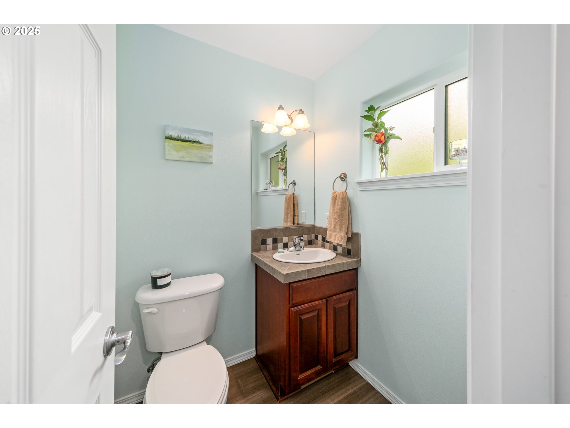 13150 D Street, Unit 12 Nehalem, OR 97131 - Photo 15 of 40 a bathroom with a toilet sink and mirror