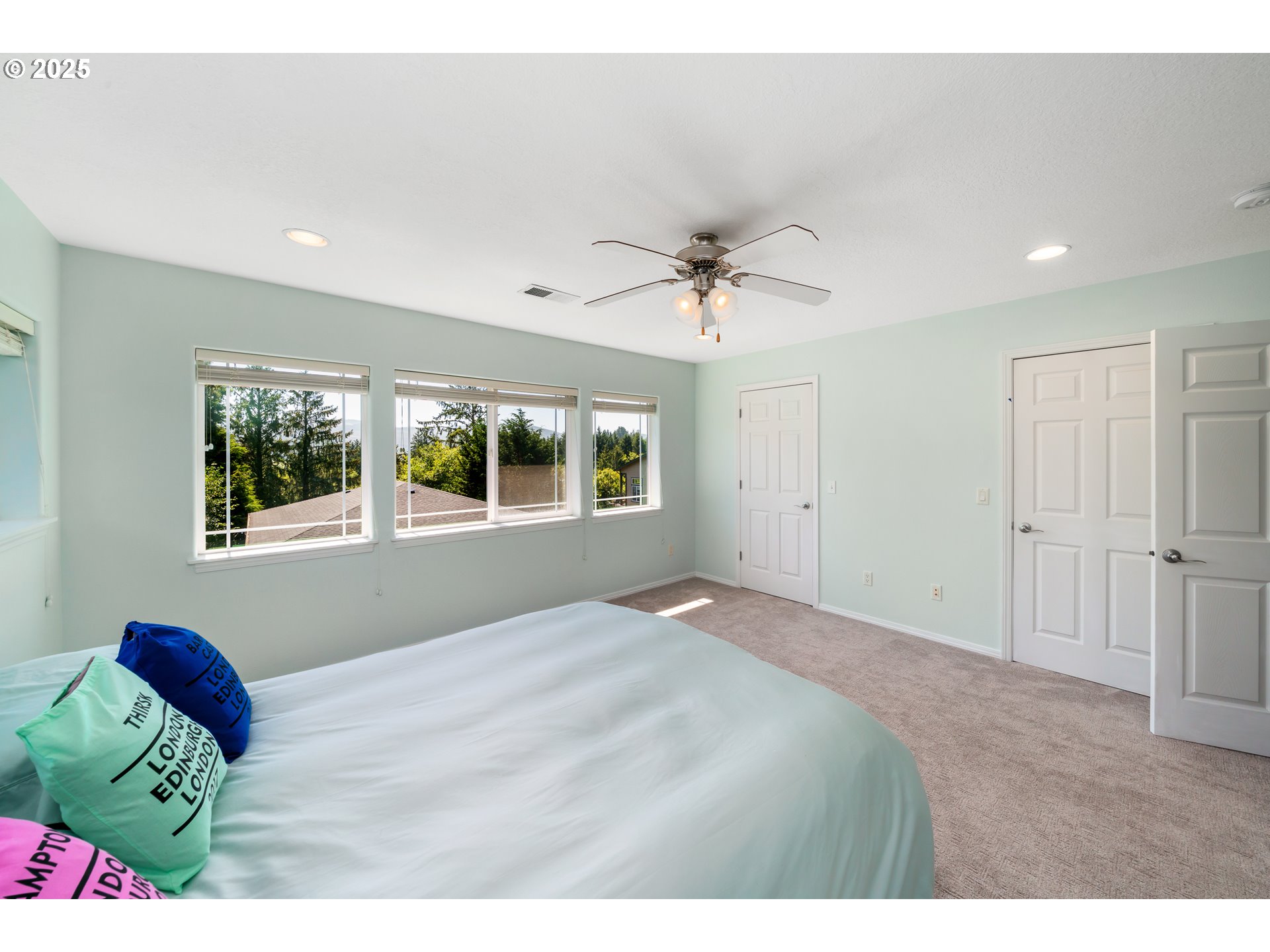 13150 D Street, Unit 12 Nehalem, OR 97131 - Photo 19 of 40 a bedroom with a bed and a window