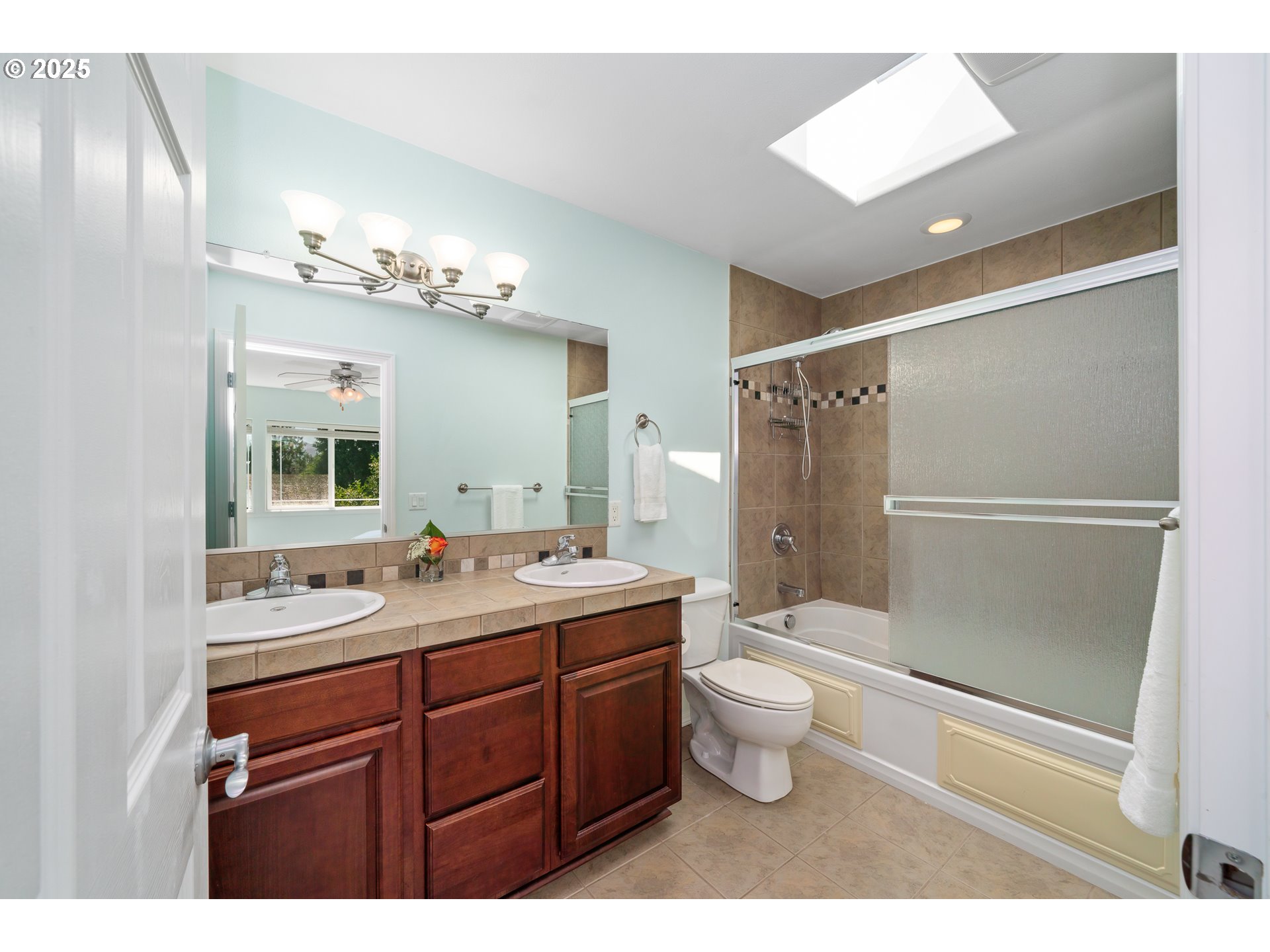 13150 D Street, Unit 12 Nehalem, OR 97131 - Photo 20 of 40 a bathroom with a sink toilet a mirror and shower