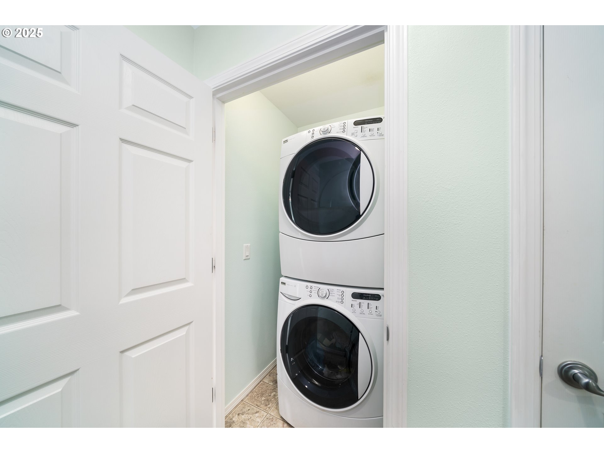 13150 D Street, Unit 12 Nehalem, OR 97131 - Photo 22 of 40 a view of a hallway with washer and dryer