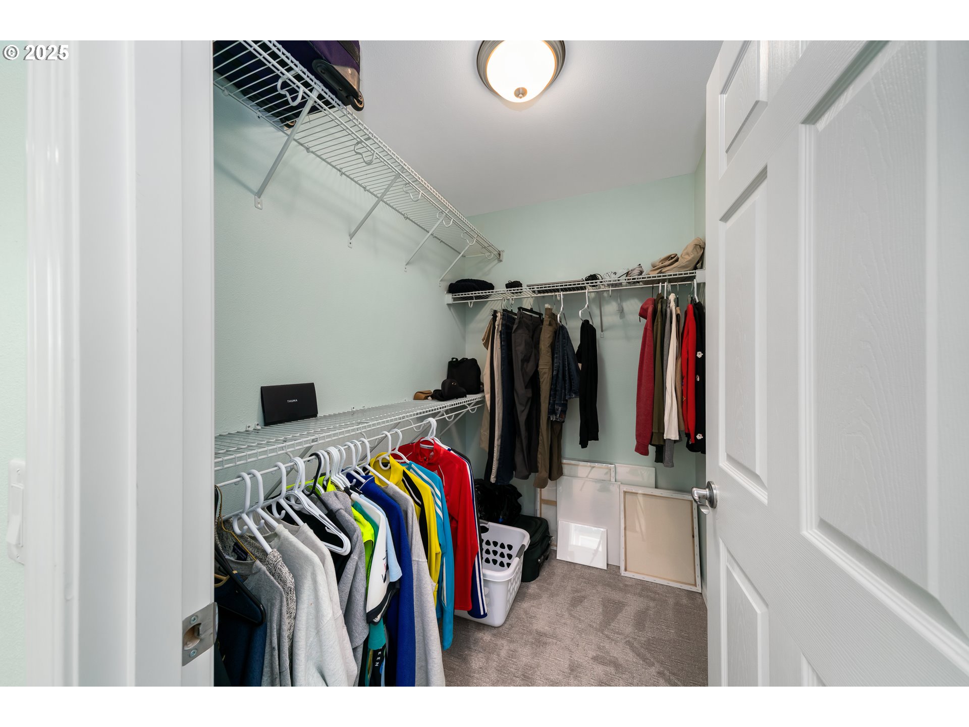 13150 D Street, Unit 12 Nehalem, OR 97131 - Photo 26 of 40 a view of walk in closet with clothes