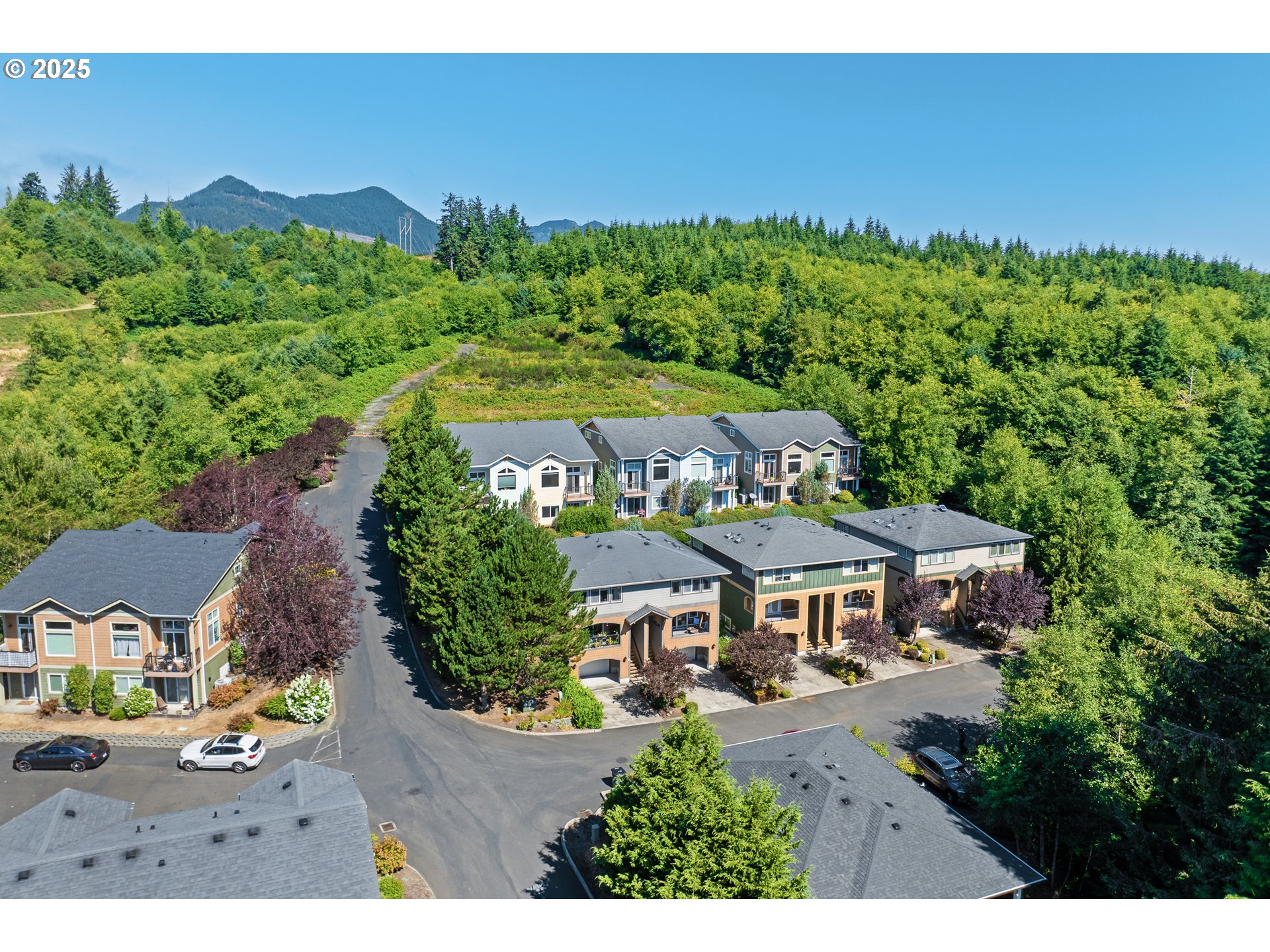 13150 D Street, Unit 12 Nehalem, OR 97131 - Photo 35 of 40 an aerial view of a house with yard table and chairs