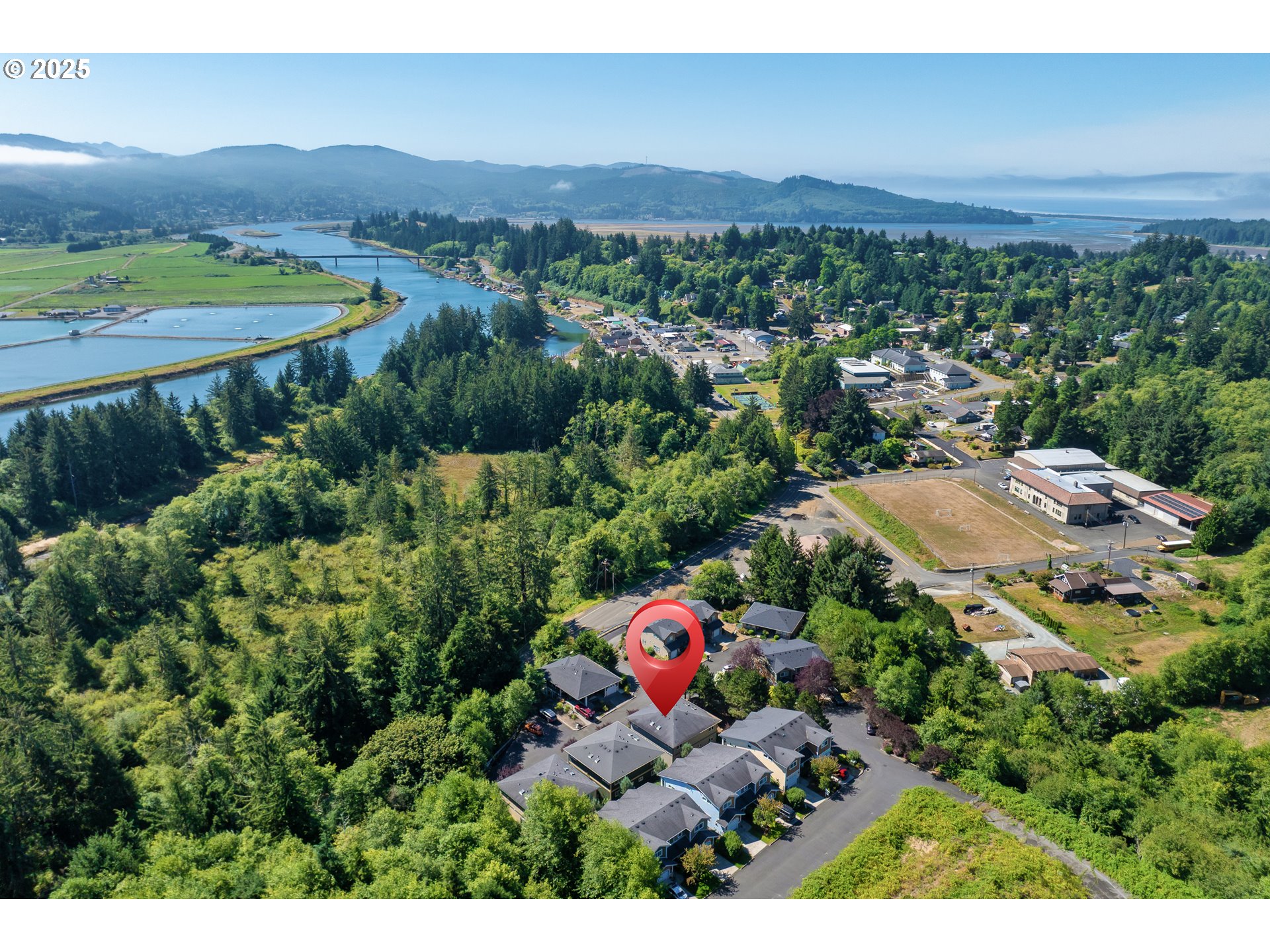 13150 D Street, Unit 12 Nehalem, OR 97131 - Photo 38 of 40 a view of a houses with a yard