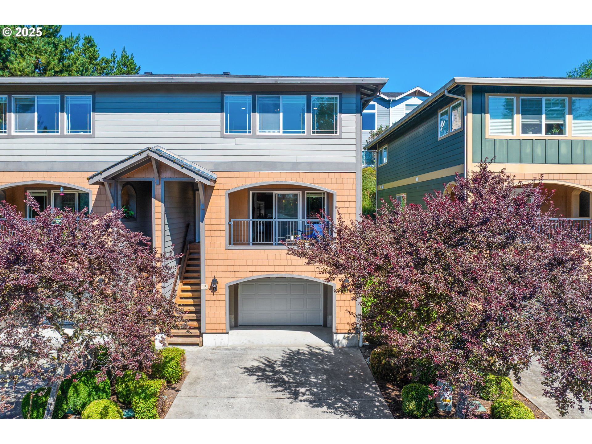 13150 D Street, Unit 12 Nehalem, OR 97131 - Photo 4 of 40 a front view of a house with a yard