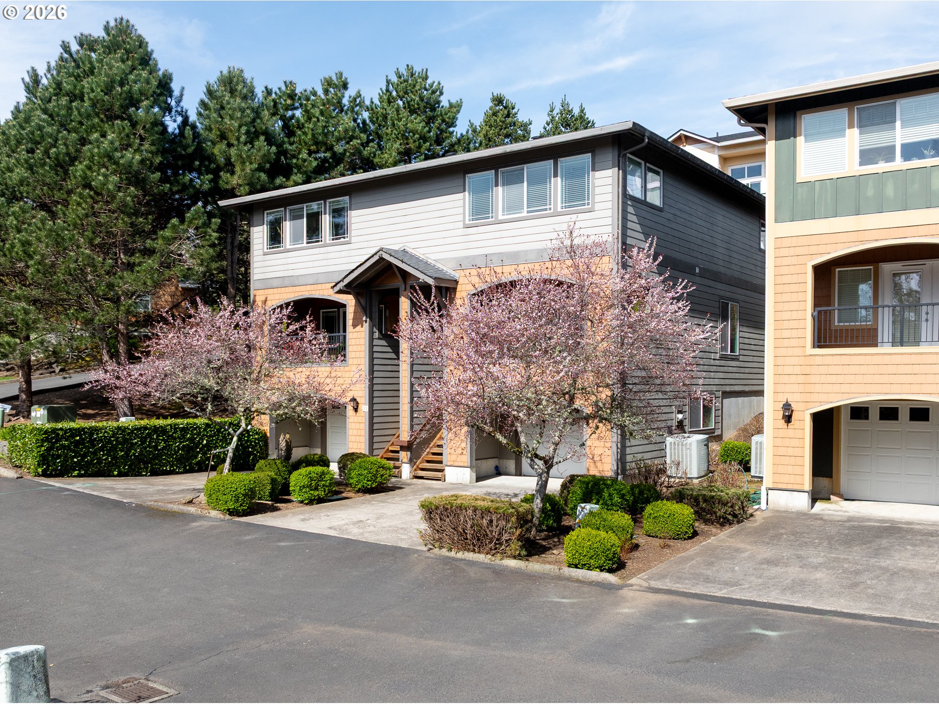 13150 D Street, Unit 12 Nehalem, OR 97131 - Photo 41 of 44 a front view of a house with a garden