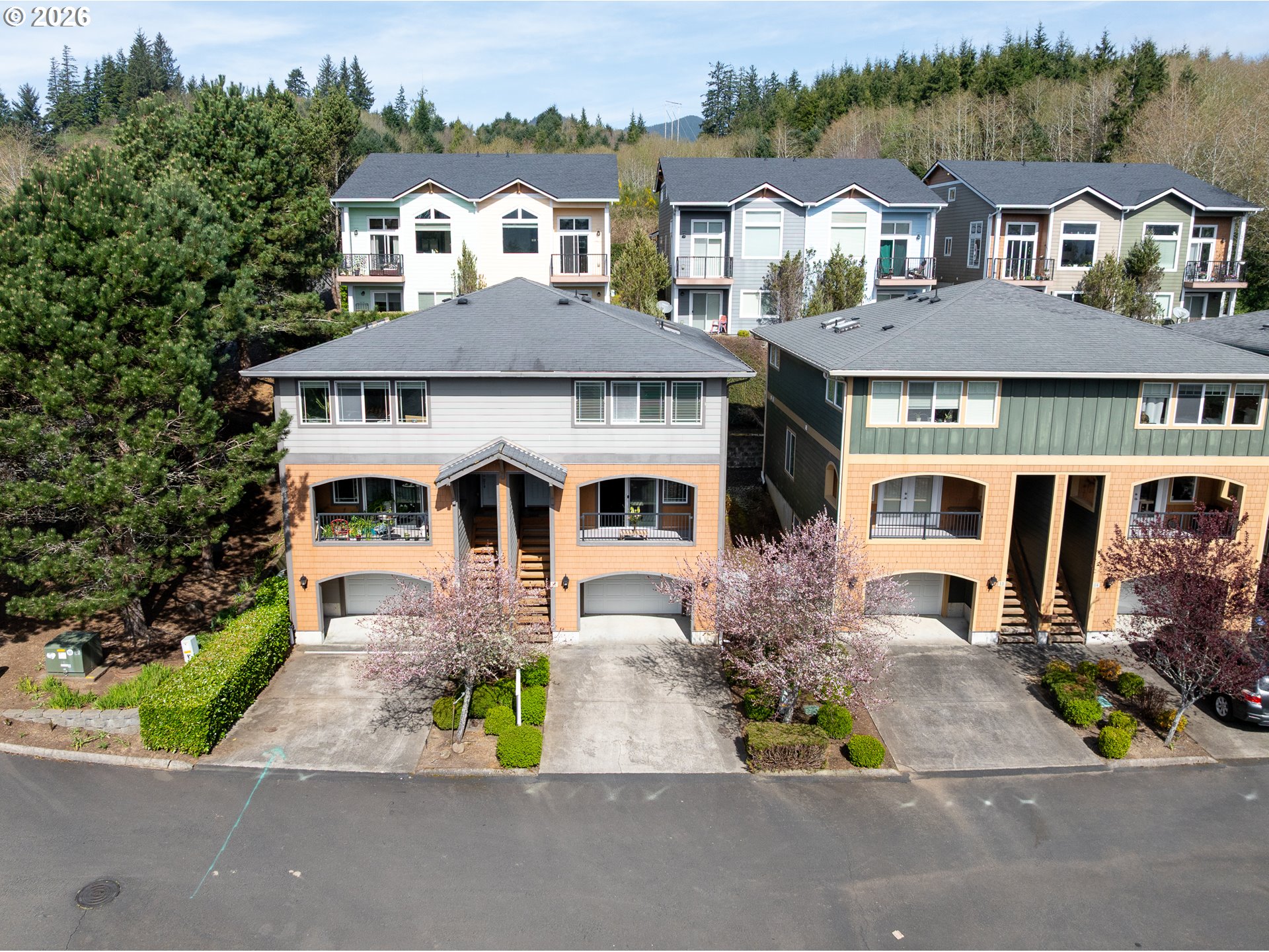 13150 D Street, Unit 12 Nehalem, OR 97131 - Photo 43 of 44 an aerial view of a house with a yard and a street