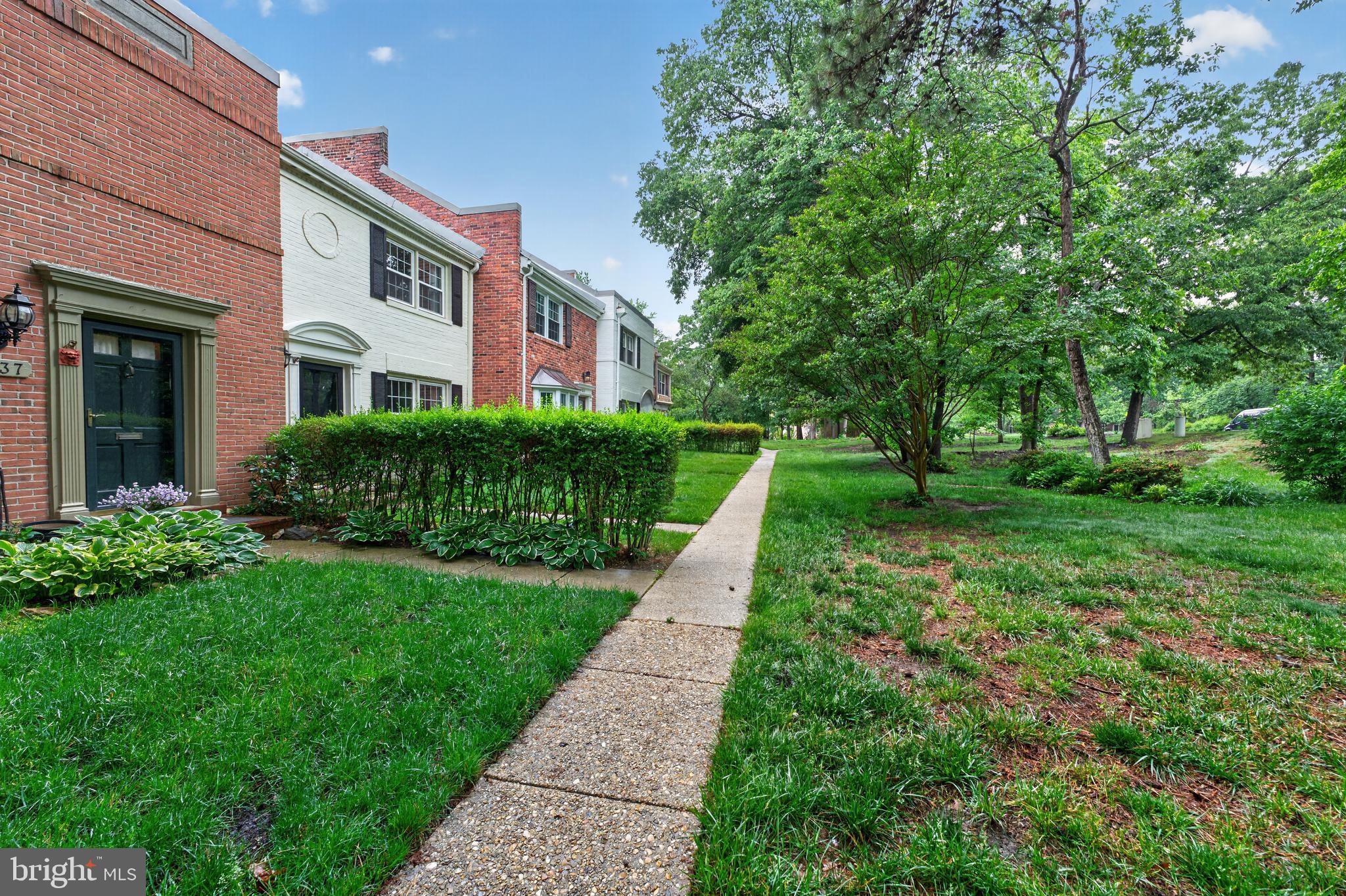 8139 Carrleigh Parkway Springfield, VA 22152 - Photo 26 of 27 a front view of a house with a yard