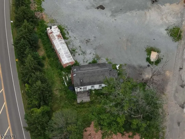 an aerial view of a house with outdoor space