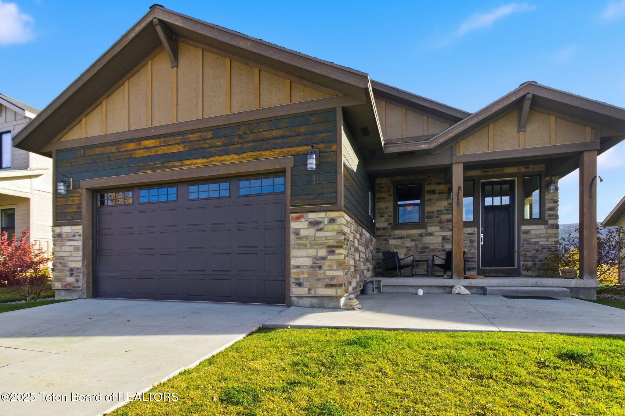 146 Swallowtail Drive Victor, ID 83455 - Photo 28 of 42 27 front porch and garage