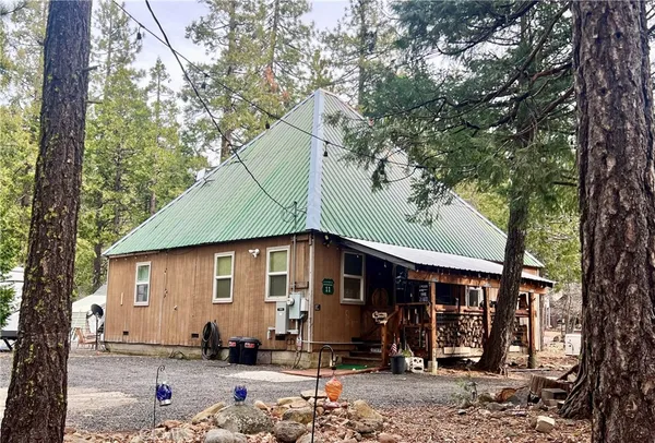 a house with tree in front of it
