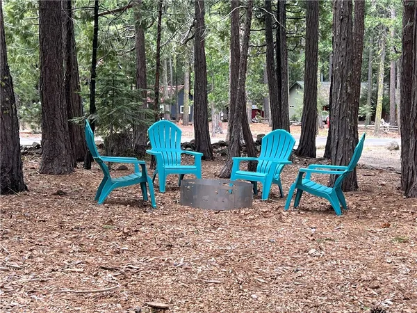 a wooden bench sitting in the middle of a forest