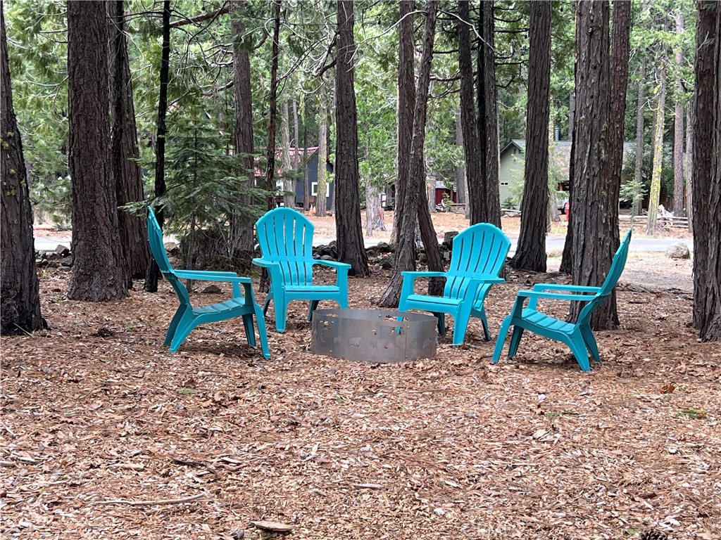 7541 Humboldt Road Butte Meadows, CA 95942 - Photo 20 of 25 a wooden bench sitting in the middle of a forest