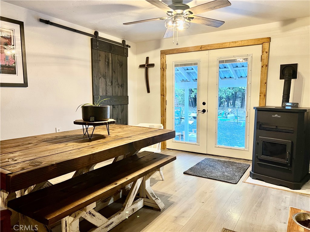 7541 Humboldt Road Butte Meadows, CA 95942 - Photo 5 of 25 a living room with a table a dining table and a fireplace