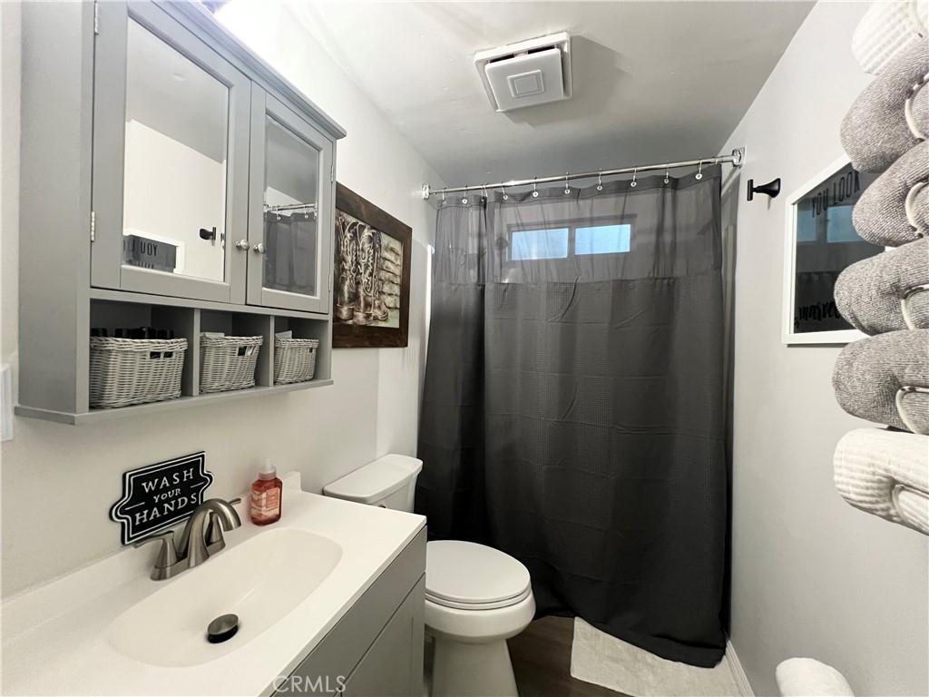 7541 Humboldt Road Butte Meadows, CA 95942 - Photo 10 of 25 a bathroom with a sink mirror vanity and toilet