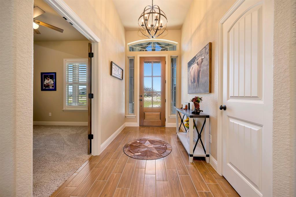 3224 North Cardinal Road Azle, TX 76020 - Photo 9 of 40 Entryway featuring ceramic tile flooring and an overhead chandelier