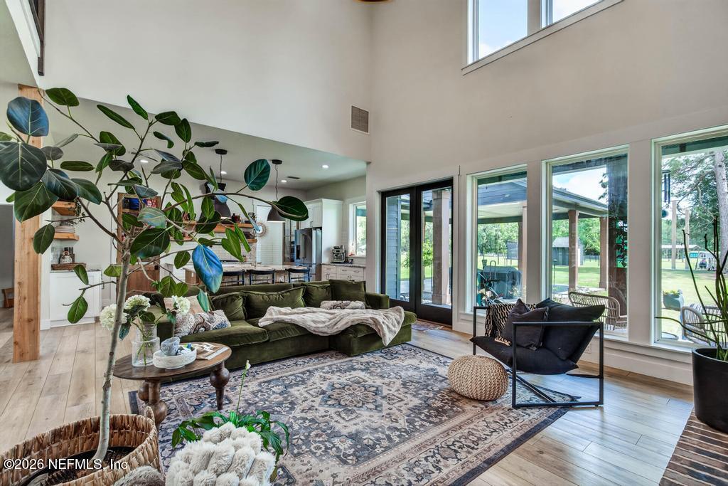 2955 Carroll Corner Road Hilliard, FL 32046 - Photo 26 of 106 a living room with furniture windows and wooden floor