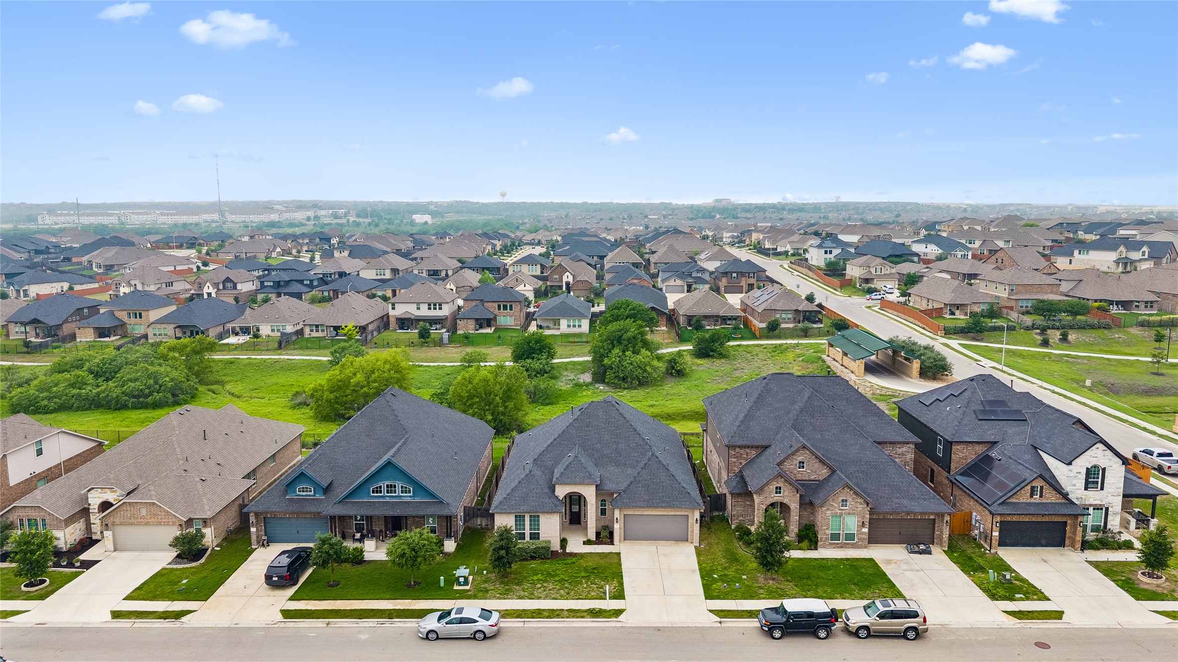 298 Wild Pecan Loop Buda, TX 78610 - Photo 37 of 40 an aerial view of multiple houses with a outdoor space