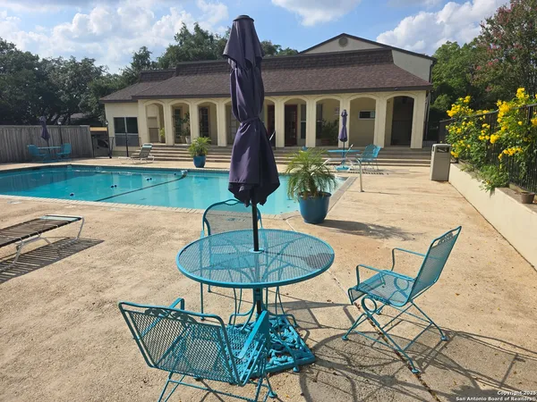 a front view of house with yard slide and outdoor seating