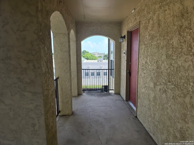 a bathroom with a shower and a sink