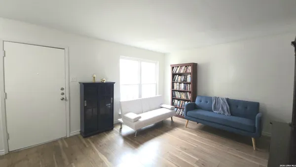 a living room with a couch and a rug
