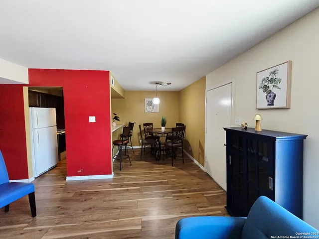 a view of a living room and dining room