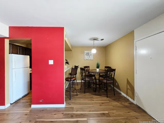 a view of a livingroom with furniture and wooden floor